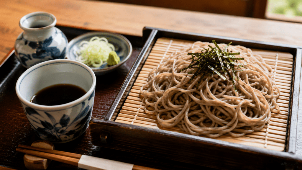 Traditional Japanese soba noodles served with dipping sauce and condiments