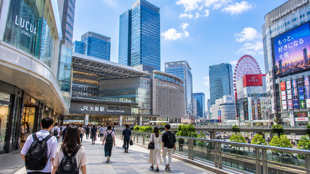 Travelers exploring the modern Umeda district in Osaka