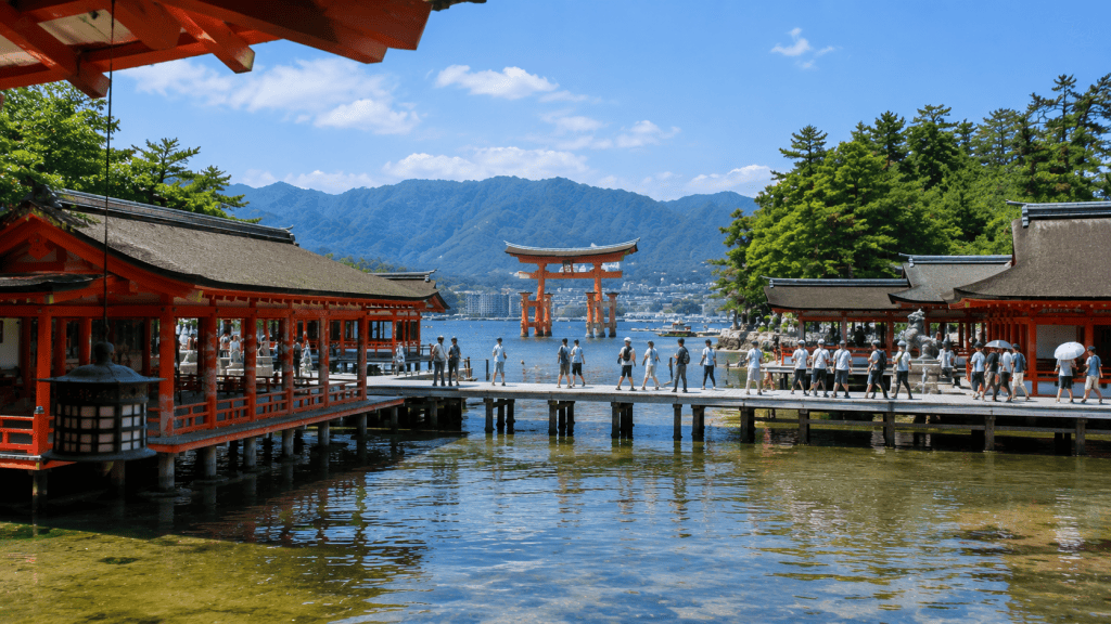Travelers visiting Itsukushima Shrine and the Great Torii Gate on Miyajima